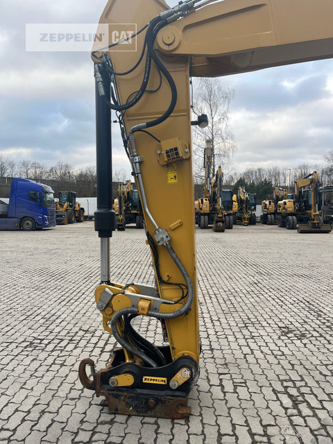 Gumikerekes kotró Cat M320F: 11 kép.