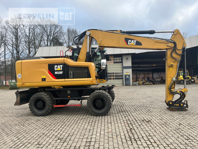 Cat M320F - Gumikerekes kotró: 3 kép. Cat M320F - Gumikerekes kotró: 3 kép.