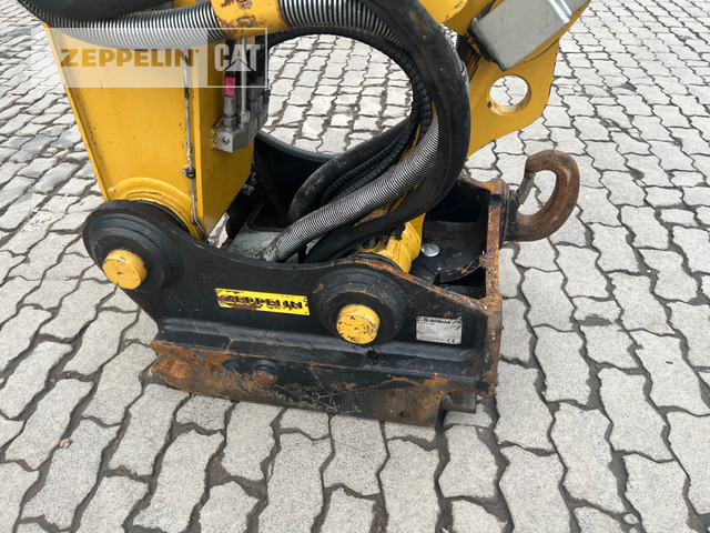 Gumikerekes kotró Cat M320F: 13 kép.