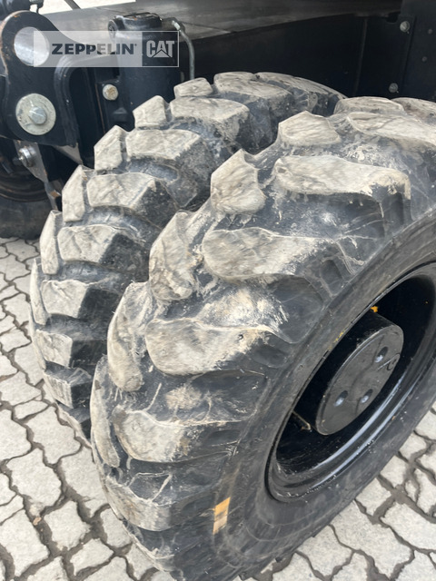 Gumikerekes kotró Cat M320F: 17 kép.