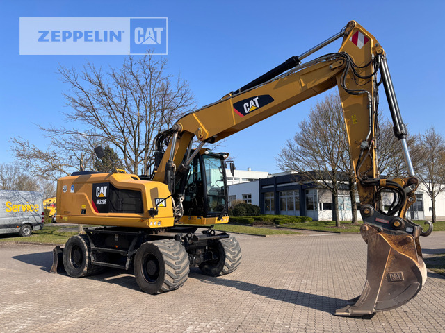 Cat M320F - Gumikerekes kotró: 2 kép. Cat M320F - Gumikerekes kotró: 2 kép.