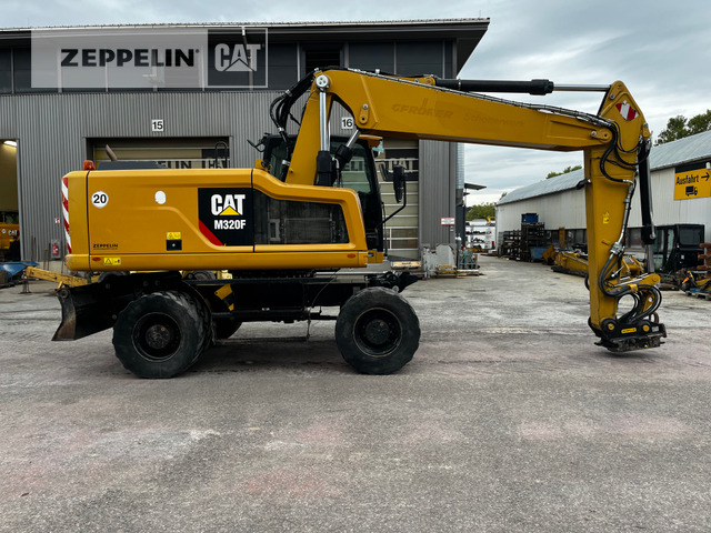 Cat M320F - Gumikerekes kotró: 5 kép. Cat M320F - Gumikerekes kotró: 5 kép.