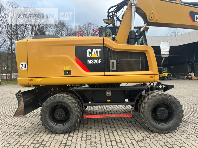 Cat M320F - Gumikerekes kotró: 4 kép. Cat M320F - Gumikerekes kotró: 4 kép.