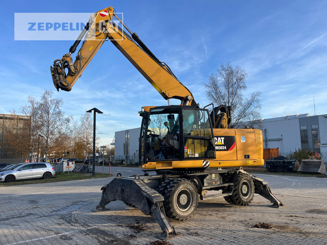 Cat MH3024-06C - Hulladék kotró: 3 kép. Cat MH3024-06C - Hulladék kotró: 3 kép.