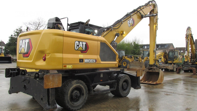 Cat MH3024-07A - Hulladék kotró: 4 kép. Cat MH3024-07A - Hulladék kotró: 4 kép.