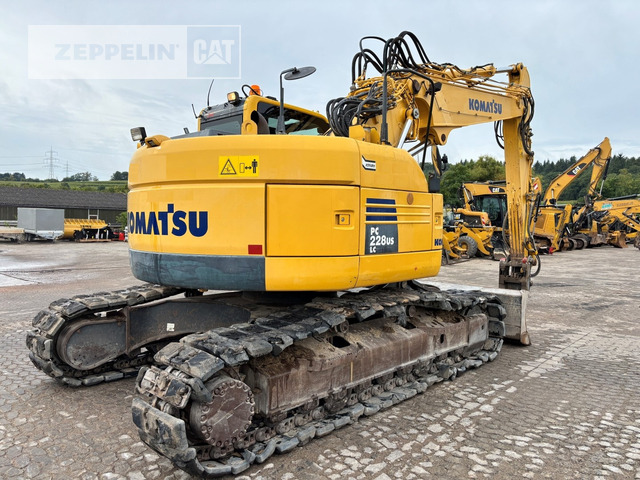 Komatsu PC228 - Lánctalpas kotró: 4 kép. Komatsu PC228 - Lánctalpas kotró: 4 kép.