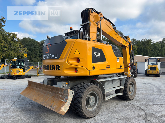 Liebherr A918 - Gumikerekes kotró: 4 kép. Liebherr A918 - Gumikerekes kotró: 4 kép.