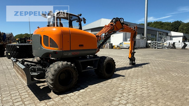 Wacker EW100 - Gumikerekes kotró: 4 kép. Wacker EW100 - Gumikerekes kotró: 4 kép.