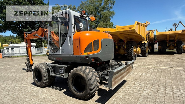 Wacker EW100 - Gumikerekes kotró: 3 kép. Wacker EW100 - Gumikerekes kotró: 3 kép.