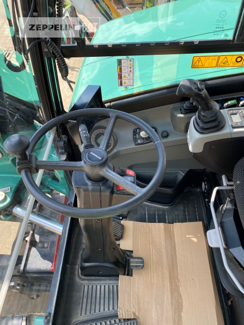 Gumikerekes kotró Zeppelin ZM110: 13 kép.