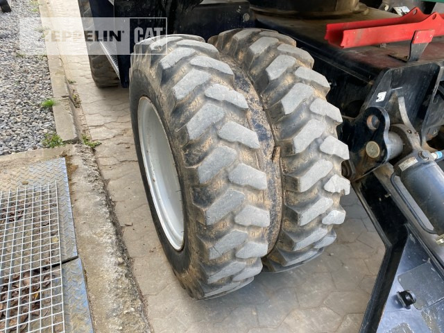 Gumikerekes kotró Zeppelin ZM110: 15 kép.