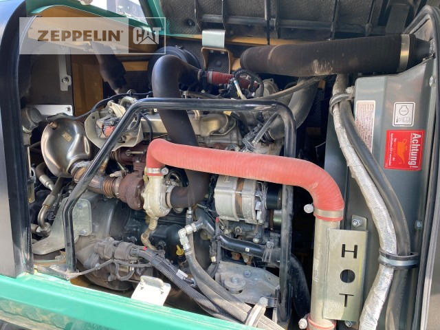 Gumikerekes kotró Zeppelin ZM110: 10 kép.