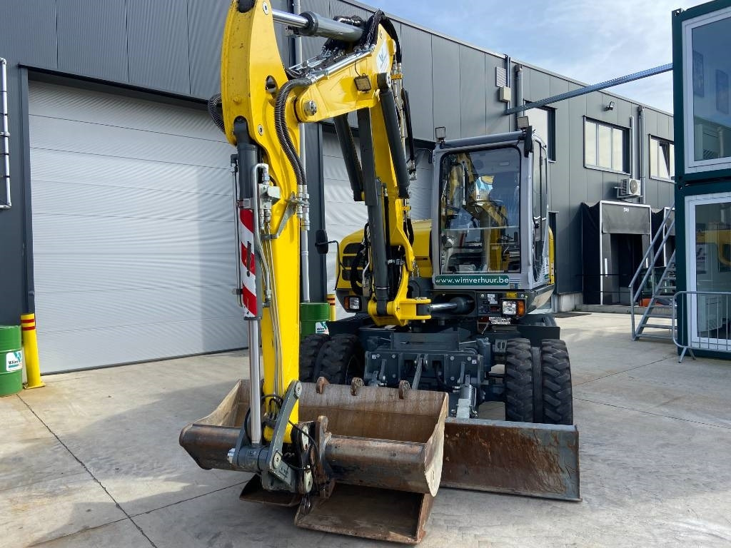 Wacker Neuson EW 100 - Gumikerekes kotró: 2 kép. Wacker Neuson EW 100 - Gumikerekes kotró: 2 kép.